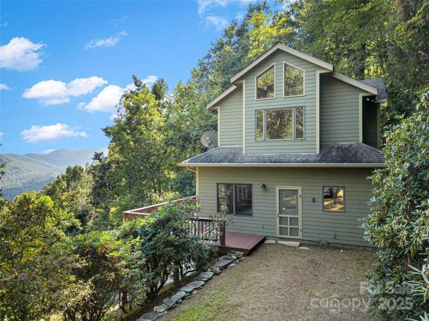 1299 Pine Ridge Road, Burnsville, NC 28714.  MLS# CAR4306270, YatesRealty ID 8091. The driveway offers flat parking for a view vehicles and turnaround space