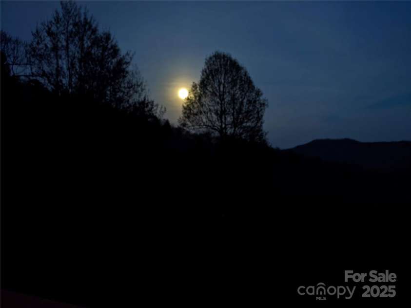 1299 Pine Ridge Road, Burnsville, NC 28714.  MLS# CAR4306270, YatesRealty ID 8091. Watch the moon rise and star gaze off your deck
