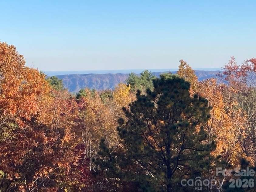 121 Toxaway Views Drive, Lake Toxaway, NC 28747.  MLS# CAR4414646, YatesRealty ID 8111. From Homeowner - Fall view from deck