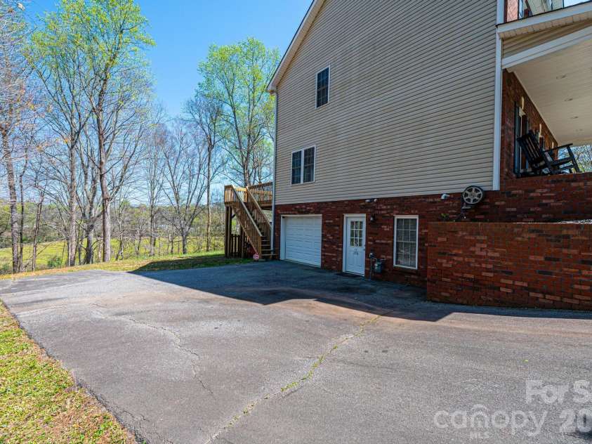 2586 Henry Falls Drive, Hickory, NC 28602.  MLS# CAR4365089, YatesRealty ID 8126. Lower Driveway & Garage
