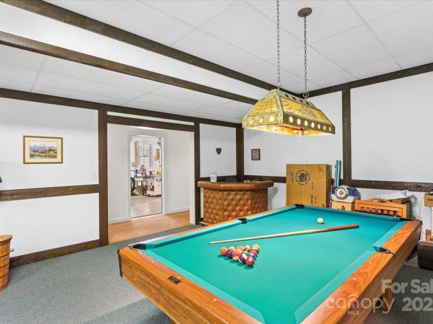 98 Fox Trail, Tryon, NC 28782.  MLS# CAR4232622, YatesRealty ID 8133. Billiard room.  Pool table conveys with property!