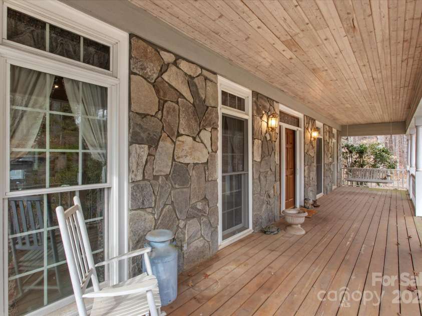 98 Fox Trail, Tryon, NC 28782.  MLS# CAR4232622, YatesRealty ID 8133. Covered front porch as well as large deck.