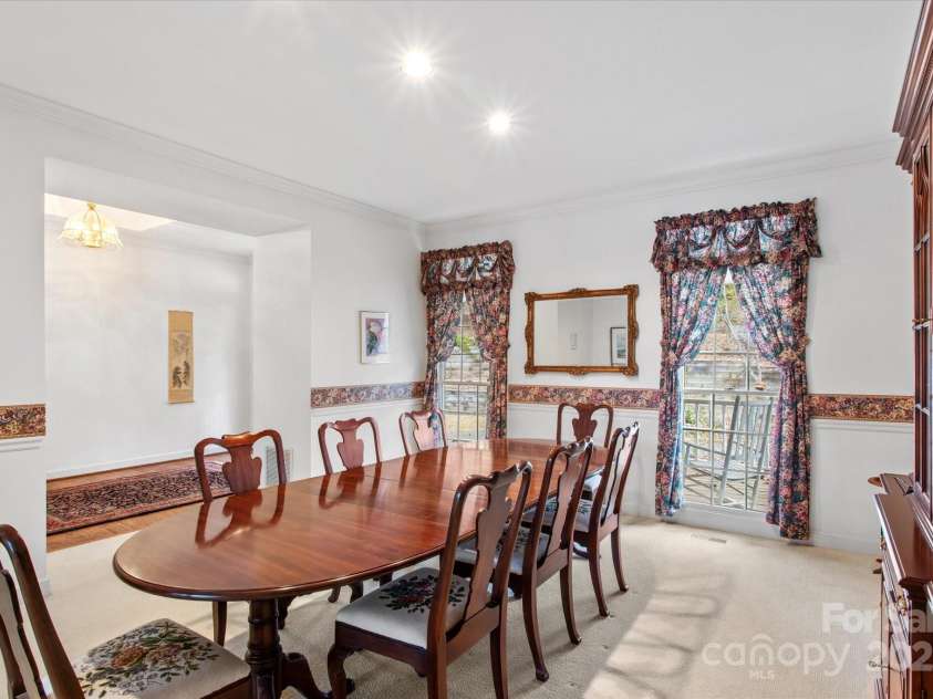 98 Fox Trail, Tryon, NC 28782.  MLS# CAR4232622, YatesRealty ID 8133. Dining room leads to foyer.