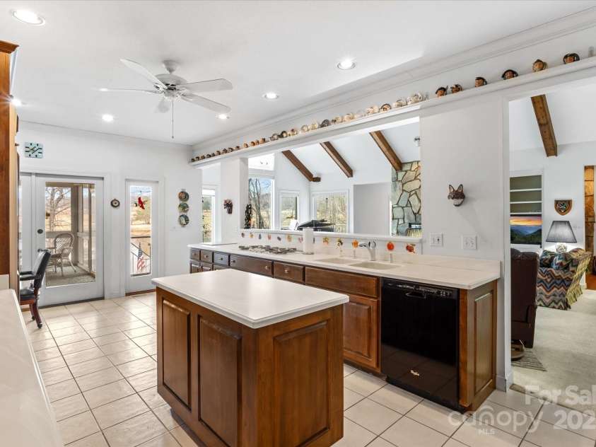 98 Fox Trail, Tryon, NC 28782.  MLS# CAR4232622, YatesRealty ID 8133. Huge open kitchen with plenty of cabinets and drawers.