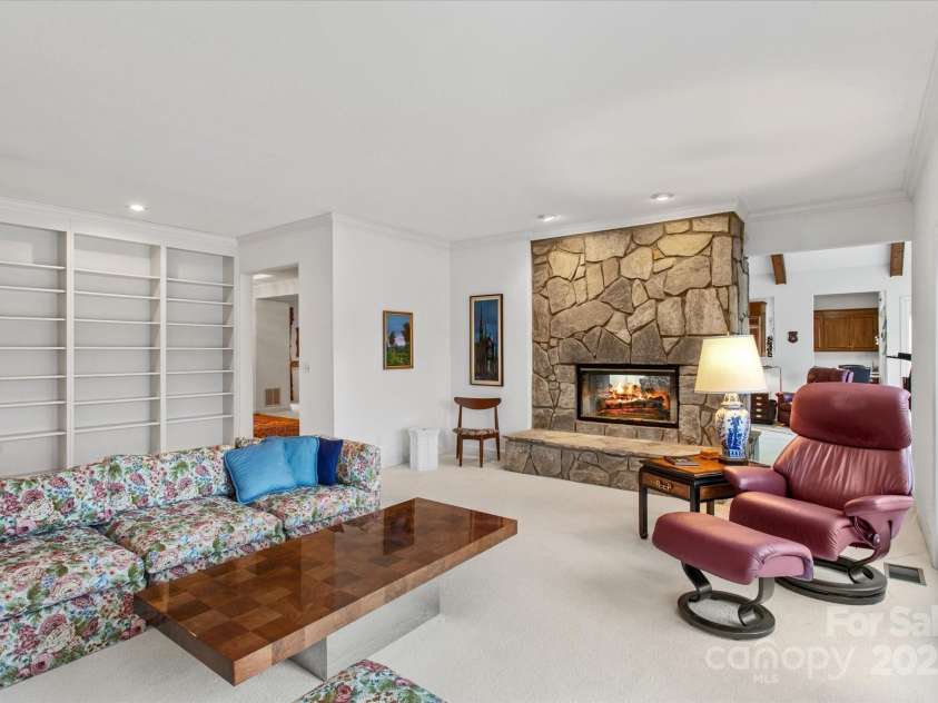 98 Fox Trail, Tryon, NC 28782.  MLS# CAR4232622, YatesRealty ID 8133. Sliding doors and built-in cabinets in the den.