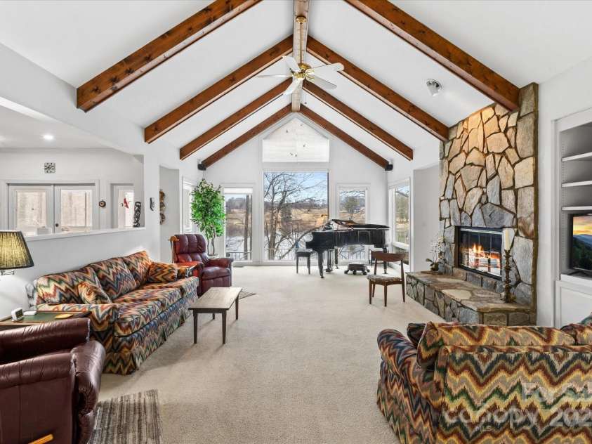 98 Fox Trail, Tryon, NC 28782.  MLS# CAR4232622, YatesRealty ID 8133. Vaulted ceilings and more built-ins in the living room.