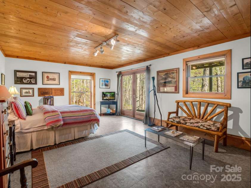 780 Rixhaven Drive, Saluda, NC 28773.  MLS# CAR4246411, YatesRealty ID 8140. Basement Bedroom with French Doors to Back Yard