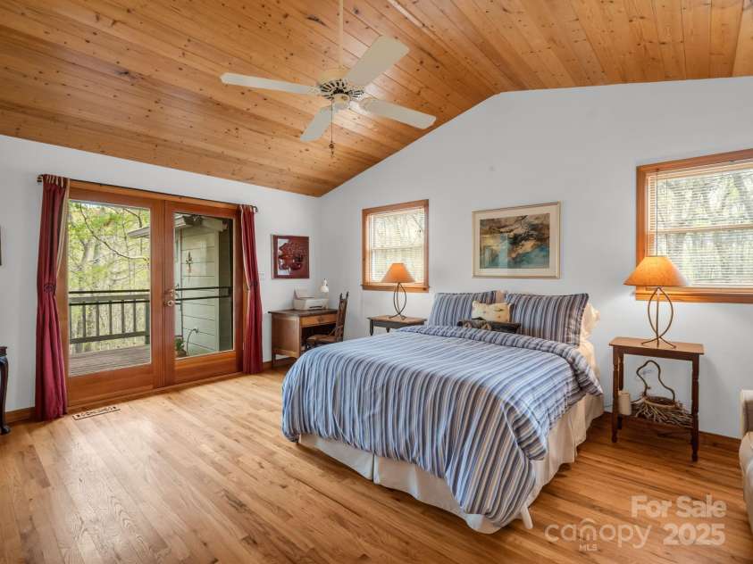 780 Rixhaven Drive, Saluda, NC 28773.  MLS# CAR4246411, YatesRealty ID 8140. Primary Bedroom doors to deck and sauna