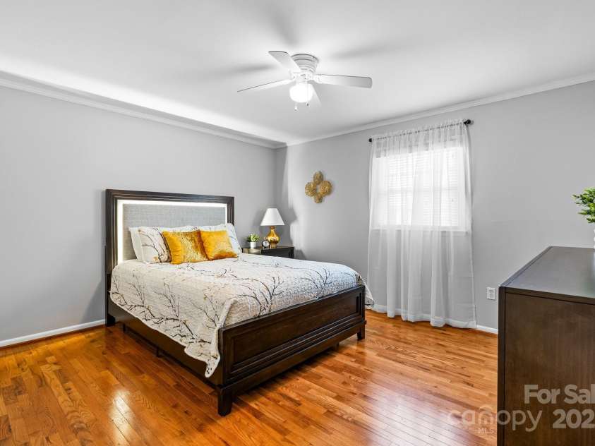 5486 Suttlemyre Lane, Hickory, NC 28601.  MLS# CAR4249269, YatesRealty ID 8145. Master Bedroom with hardwood flooring, crown molding, freshly painted.