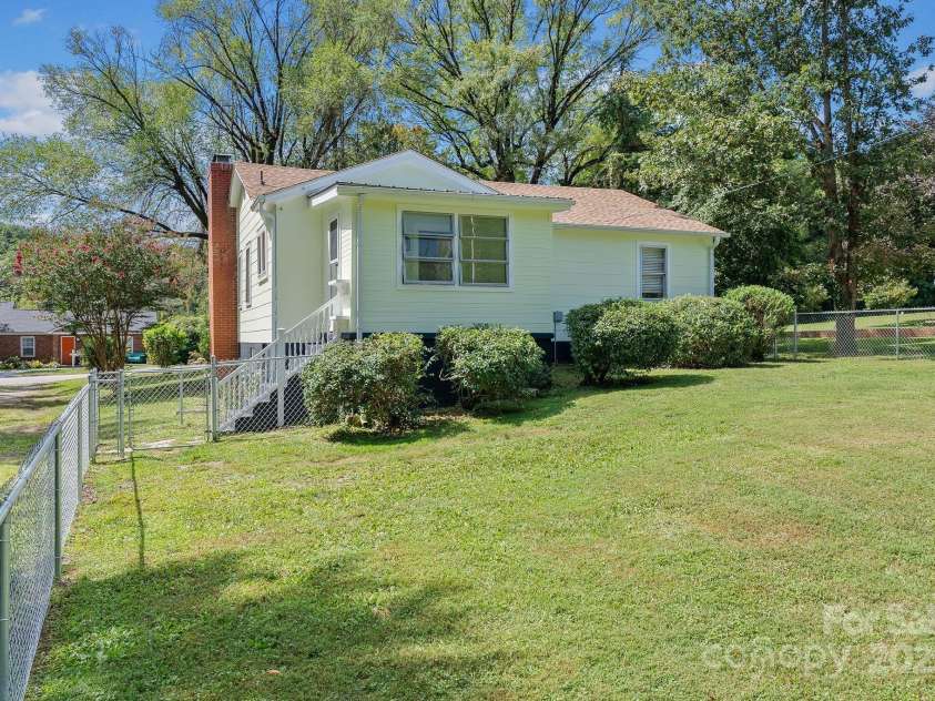 318 Stoney Mountain Road, Hendersonville, NC 28791.  MLS# CAR4235178, YatesRealty ID 8150. Imagine all of the good times that can be had in this ample back yard.