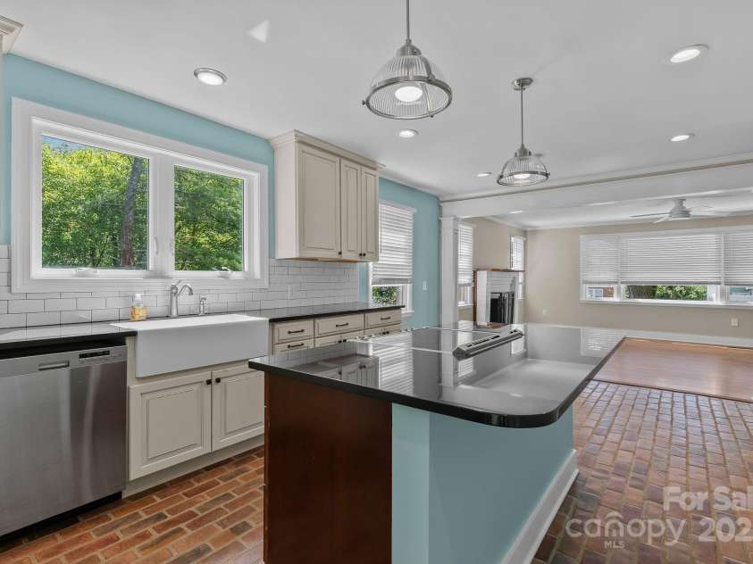 318 Stoney Mountain Road, Hendersonville, NC 28791.  MLS# CAR4235178, YatesRealty ID 8150. Note the farmhouse sink, stainless appliances and updated lighting fixtures.