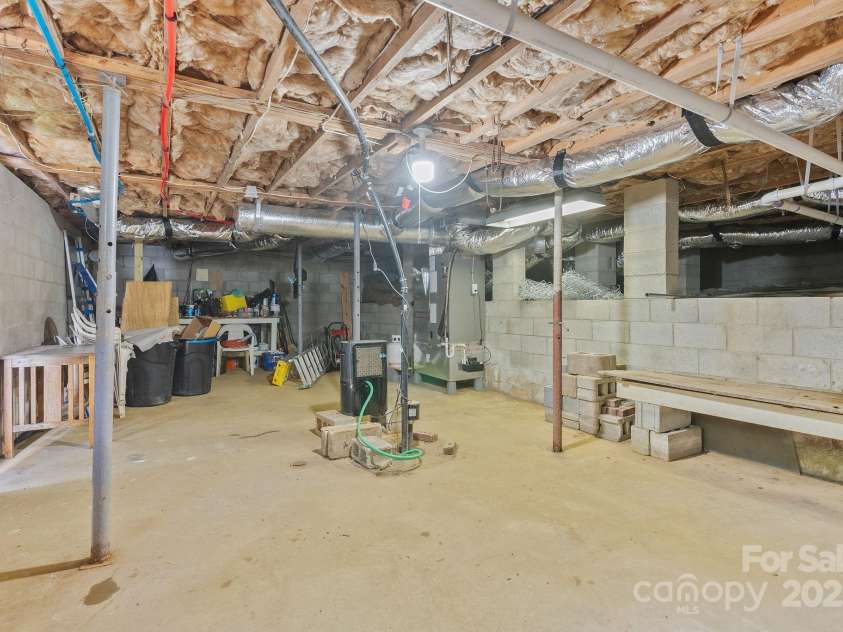 318 Stoney Mountain Road, Hendersonville, NC 28791.  MLS# CAR4235178, YatesRealty ID 8150. The basement has a separate entrance and is a great space for storage and for accessing the home's systems.