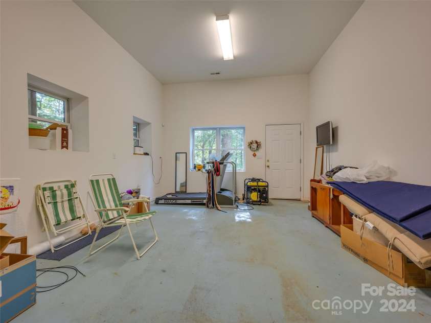 65 Winfield Cove, Saluda, NC 28773.  MLS# CAR4076540, YatesRealty ID 8151. Basement Garage Room/Exercise