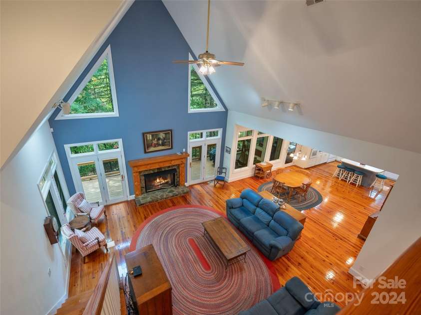 65 Winfield Cove, Saluda, NC 28773.  MLS# CAR4076540, YatesRealty ID 8151. Looking over living room from upstairs