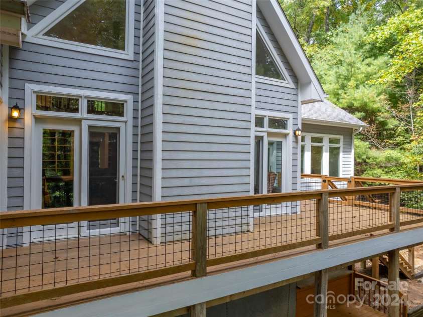 65 Winfield Cove, Saluda, NC 28773.  MLS# CAR4076540, YatesRealty ID 8151. Lovely deck on back of house