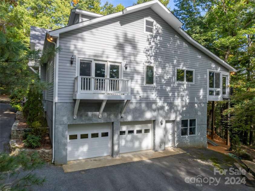 65 Winfield Cove, Saluda, NC 28773.  MLS# CAR4076540, YatesRealty ID 8151. Right side of house & 2 car garage