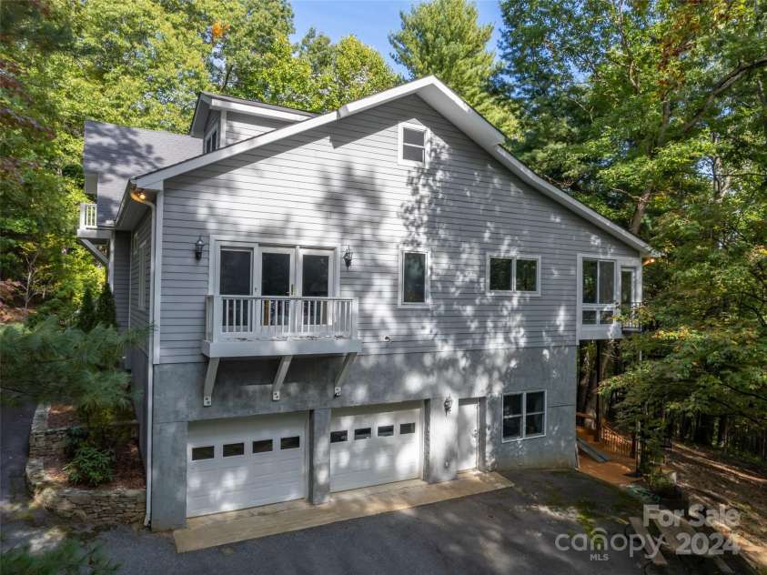 65 Winfield Cove, Saluda, NC 28773.  MLS# CAR4076540, YatesRealty ID 8151. Side view of house