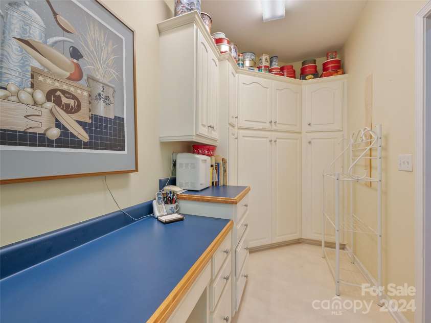 65 Winfield Cove, Saluda, NC 28773.  MLS# CAR4076540, YatesRealty ID 8151. Storage in laundry room