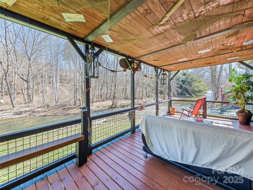 21 Swift Stream Lane, Waynesville, NC 28785.  MLS# CAR4227039, YatesRealty ID 8155. COVERED DECK OVERLOOKING STREAM