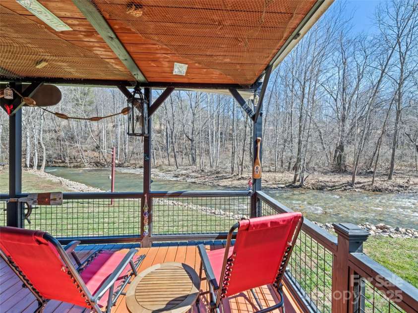 21 Swift Stream Lane, Waynesville, NC 28785.  MLS# CAR4227039, YatesRealty ID 8155. COVERED PORCH OVERLOOKING STREAM