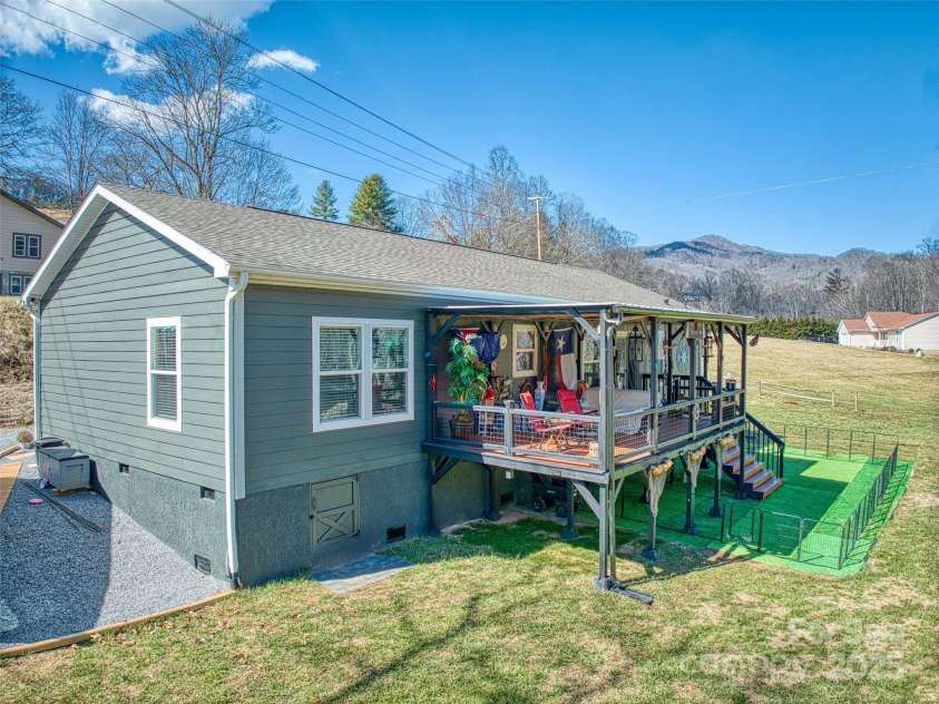 21 Swift Stream Lane, Waynesville, NC 28785.  MLS# CAR4227039, YatesRealty ID 8155. COVERED PORCH OVERLOOKING STREAM-GREAT FOR ENTERTAINING