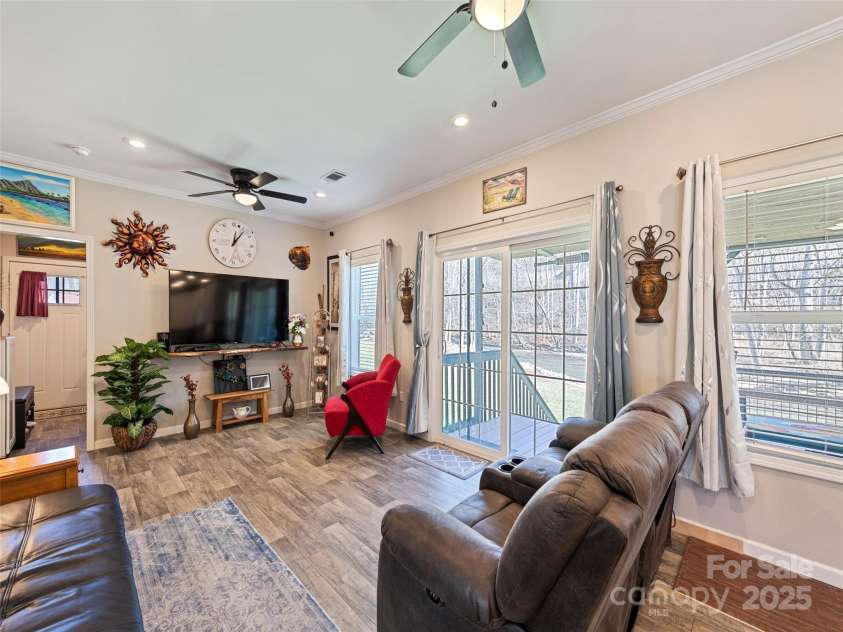 21 Swift Stream Lane, Waynesville, NC 28785.  MLS# CAR4227039, YatesRealty ID 8155. FAMILY ROOM OVERLOOKING STREAM