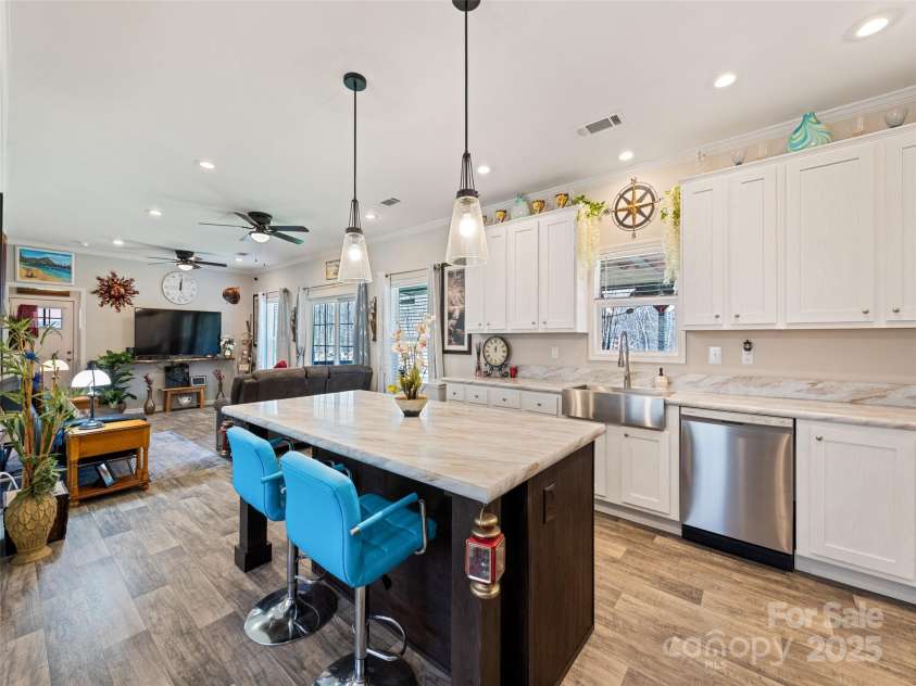 21 Swift Stream Lane, Waynesville, NC 28785.  MLS# CAR4227039, YatesRealty ID 8155. VIEW OF FAMILY ROOM FROM KITCHEN