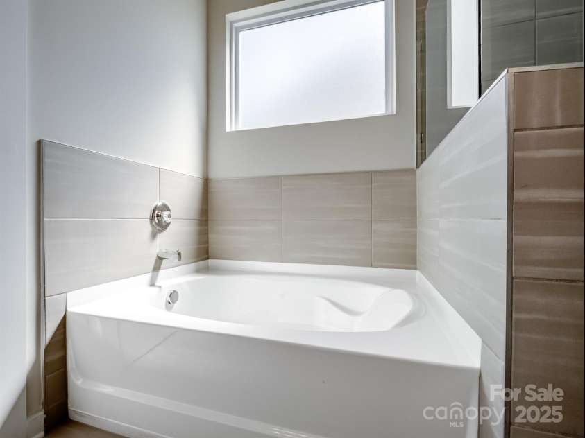 1045 Cavalier Lane, Rock Hill, SC 29730.  MLS# CAR4244737, YatesRealty ID 8160. Primary bathroom with large tub