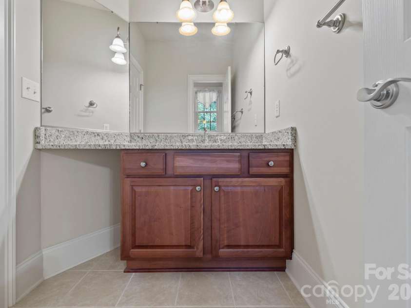 46 Beale Court, Fletcher, NC 28732.  MLS# CAR4287874, YatesRealty ID 8168. Secondary en suite Bathroom #2 - separate vanity suite with shared bath