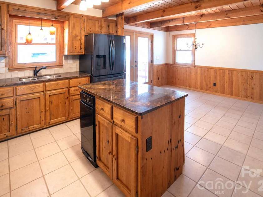 1368 Cajah Mountain Road, Hudson, NC 28638.  MLS# CAR4364291, YatesRealty ID 8171. Kitchen joins expansive Dining Area
