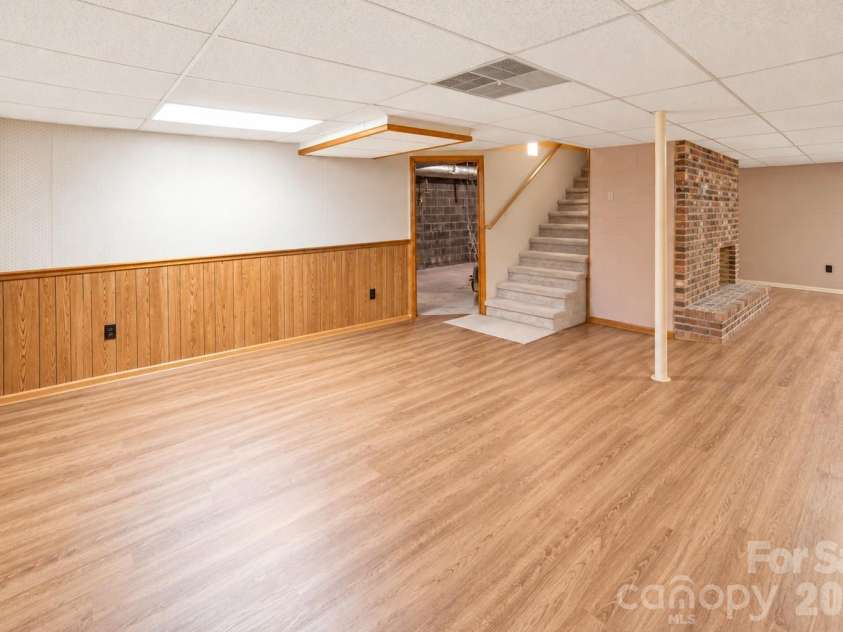 1368 Cajah Mountain Road, Hudson, NC 28638.  MLS# CAR4364291, YatesRealty ID 8171. Lower Level Den alongside Rec/Game Rm