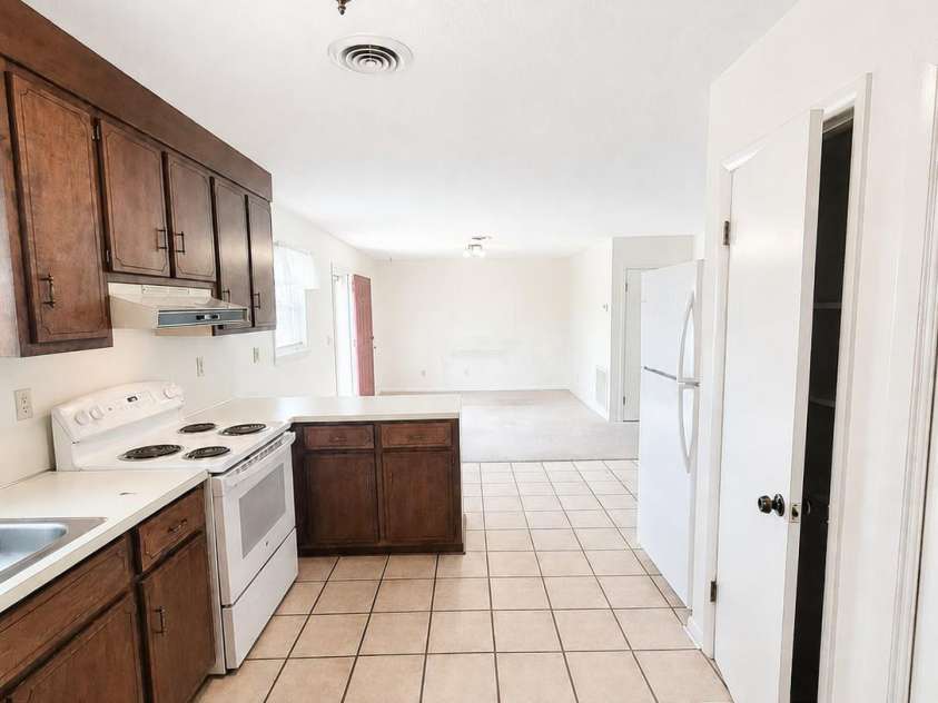 1368 Cajah Mountain Road, Hudson, NC 28638.  MLS# CAR4364291, YatesRealty ID 8171. Spacious Kitchen w Pantry + Laundry Closet