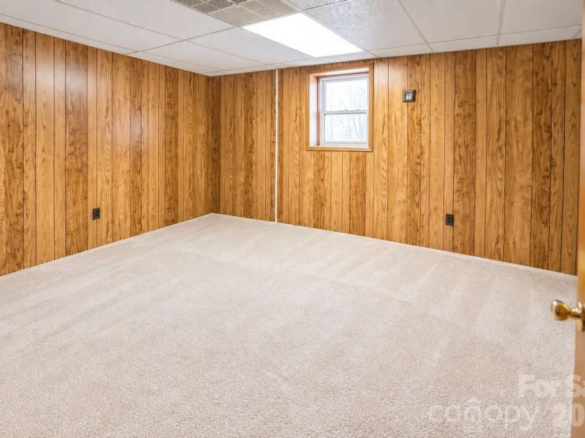 1368 Cajah Mountain Road, Hudson, NC 28638.  MLS# CAR4364291, YatesRealty ID 8171. Spacious Lower Level Bdrm