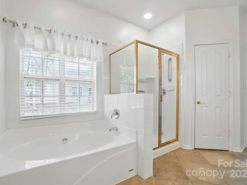 212 Kilborne Road, Mooresville, NC 28117.  MLS# CAR4245261, YatesRealty ID 8173. Garden Tub & Separate Shower