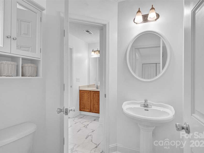 126 Newsome Road, Salisbury, NC 28146.  MLS# CAR4246225, YatesRealty ID 8180. Downstairs toilet has access from living area and primary bedroom.