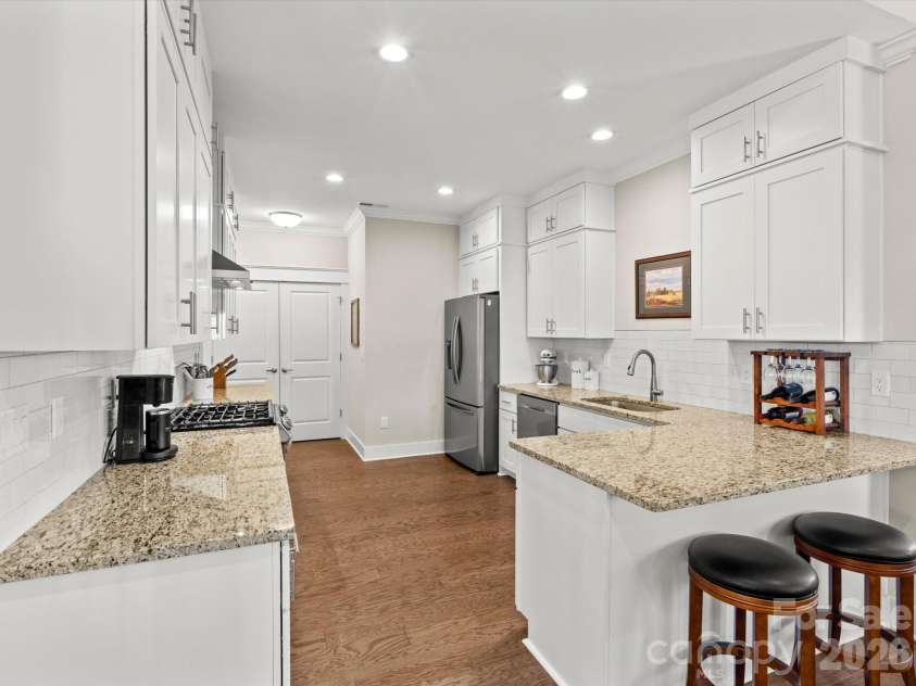 111 Ellis Lane, Arden, NC 28704.  MLS# CAR4362582, YatesRealty ID 8190. Gleaming granite countertops