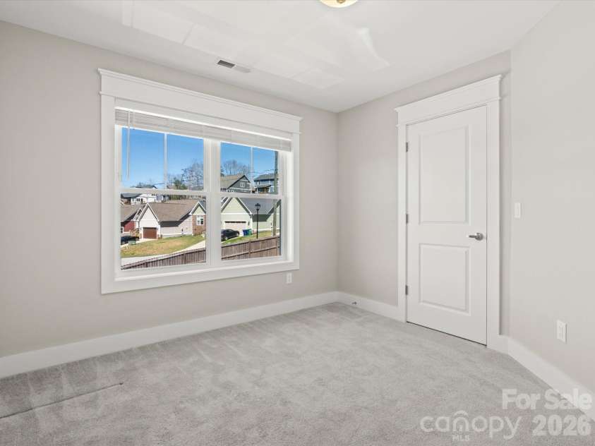 111 Ellis Lane, Arden, NC 28704.  MLS# CAR4362582, YatesRealty ID 8190. Second bedroom upstairs also has nice large windows