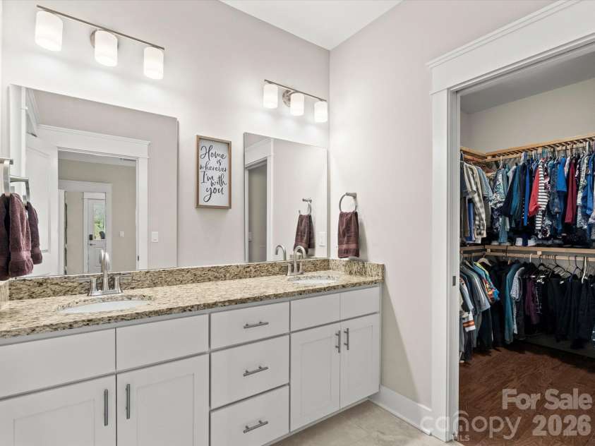 111 Ellis Lane, Arden, NC 28704.  MLS# CAR4362582, YatesRealty ID 8190. The en suite walk-in closet has custom wood shelving