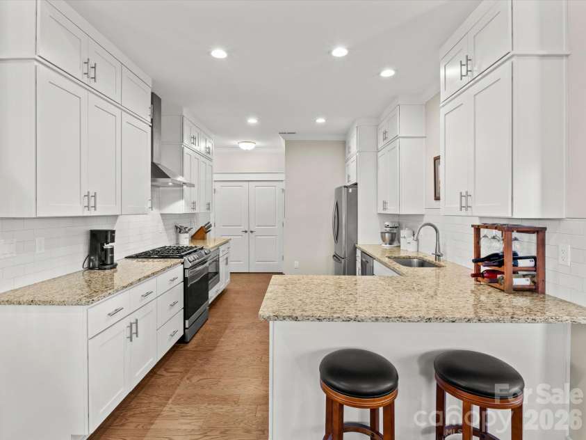 111 Ellis Lane, Arden, NC 28704.  MLS# CAR4362582, YatesRealty ID 8190. The kitchen also features a large closet pantry with double doors and built-in wood shelves