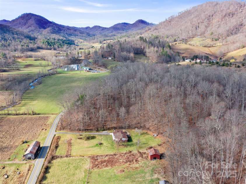 1040 Prices Creek Road, Burnsville, NC 28714.  MLS# CAR4230576, YatesRealty ID 8192. Aerial View of surrounding farmland