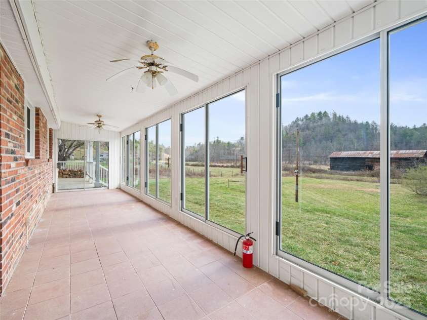 1040 Prices Creek Road, Burnsville, NC 28714.  MLS# CAR4230576, YatesRealty ID 8192. Enclosed Sun Porch