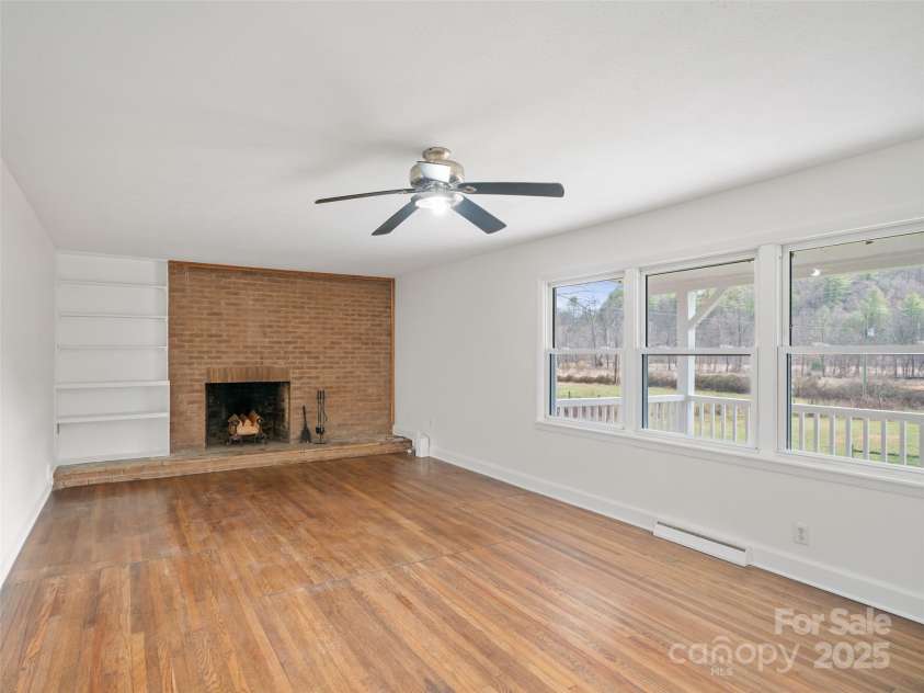 1040 Prices Creek Road, Burnsville, NC 28714.  MLS# CAR4230576, YatesRealty ID 8192. Living Room with Fireplace