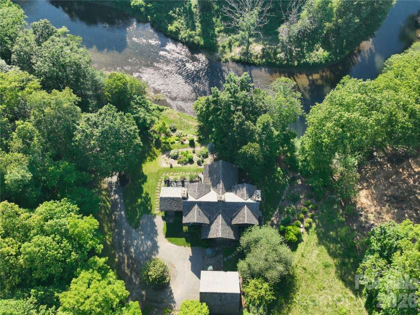 99 Thistle Ridge, Canton, NC 28716.  MLS# CAR4316255, YatesRealty ID 8194. Magical Riverfront Retreat