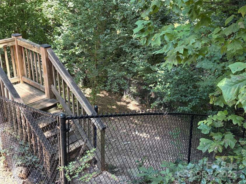 80 Laurel Avenue, Tryon, NC 28782.  MLS# CAR4299418, YatesRealty ID 820. Fenced yard with access from the house, perfect for pets.