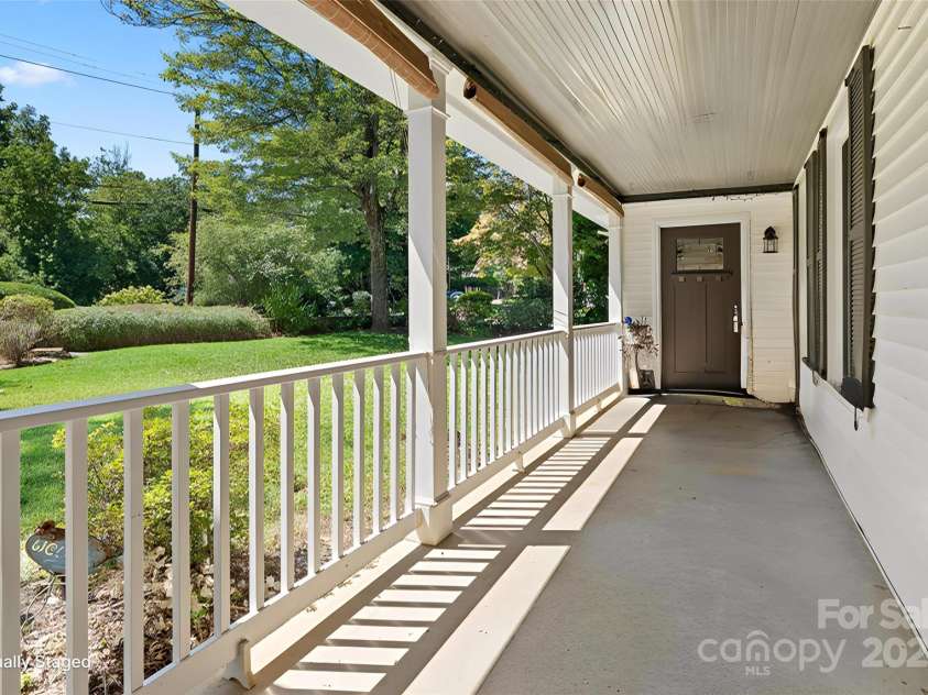 80 Laurel Avenue, Tryon, NC 28782.  MLS# CAR4299418, YatesRealty ID 820. Front porch with door to apartment.