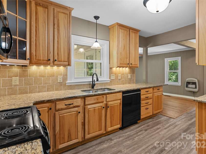 80 Laurel Avenue, Tryon, NC 28782.  MLS# CAR4299418, YatesRealty ID 820. Great new kitchen with granite countertops and solid wood cabinets.