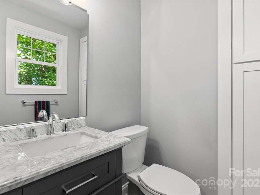80 Laurel Avenue, Tryon, NC 28782.  MLS# CAR4299418, YatesRealty ID 820. Renovated half bath on main floor of house.