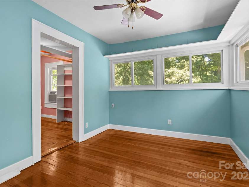 80 Laurel Avenue, Tryon, NC 28782.  MLS# CAR4299418, YatesRealty ID 820. Third bedroom with attached walk in closet.