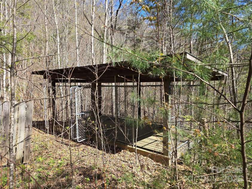 318 Brown Mountain Drive, Cullowhee, NC 28723.  MLS# CAR4235887, YatesRealty ID 8200. 4 bay covered dog kennel