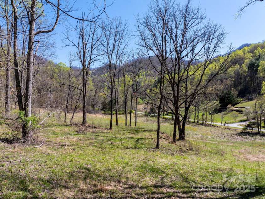 318 Brown Mountain Drive, Cullowhee, NC 28723.  MLS# CAR4235887, YatesRealty ID 8200. 7+/- acre pasture along John's Creek & Road. Complete with Horse Shed & Hay Storage Shed